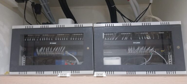 Wall mounted network rack with switches installed by YOM Computer Ahmedabad